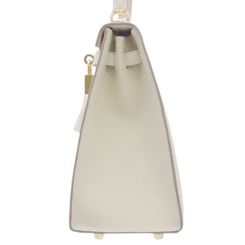 Kelly 25 (Exterior Stitched) Voe Epsom Leather, Cre color, Gold Hardware, U stamp.