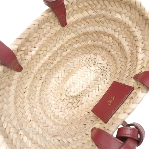 Triomphe Panier Mini Basket in Raffia and Leather, Bordeaux and Beige.  A woven basket bag, suitable for shoulder or hand carrying.