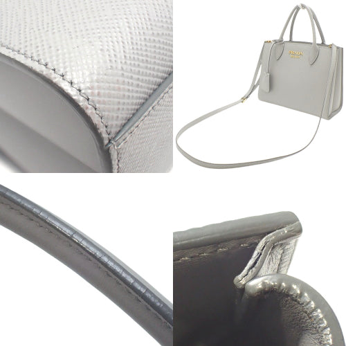 两用手提包、单肩包、托特包,采用 Saffiano 皮革制成,SAFFIANO CUIR+C NUBE+NERO,1BA284