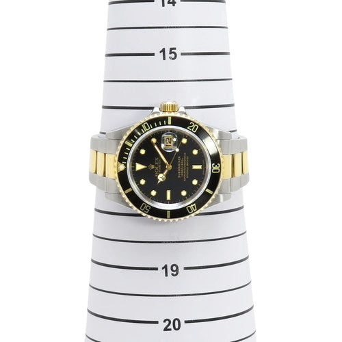 16613 型潜航者型腕表,黄金/不锈钢材质,N字头,自动上链。