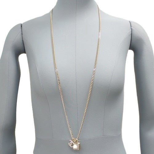 Coco Mark Rhinestone Long Necklace in Metal (GP) with Faux Pearls, Rhinestones, Padlock, and Cadena Motif
