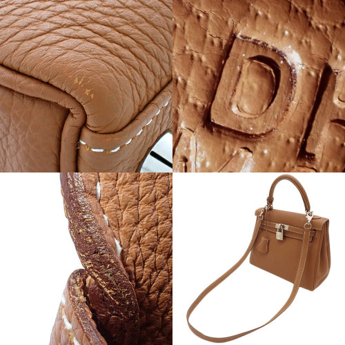 Kelly 25(内缝线)Togo,钯金配件,金色 D 形印章