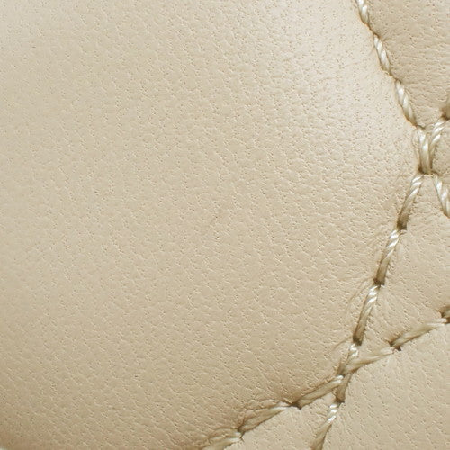 Lady Dior My ABCDior bag in small size, made of lambskin, beige color, model M0538ONGE_M63U. It's a 2-way bag, suitable for shoulder or crossbody carrying.