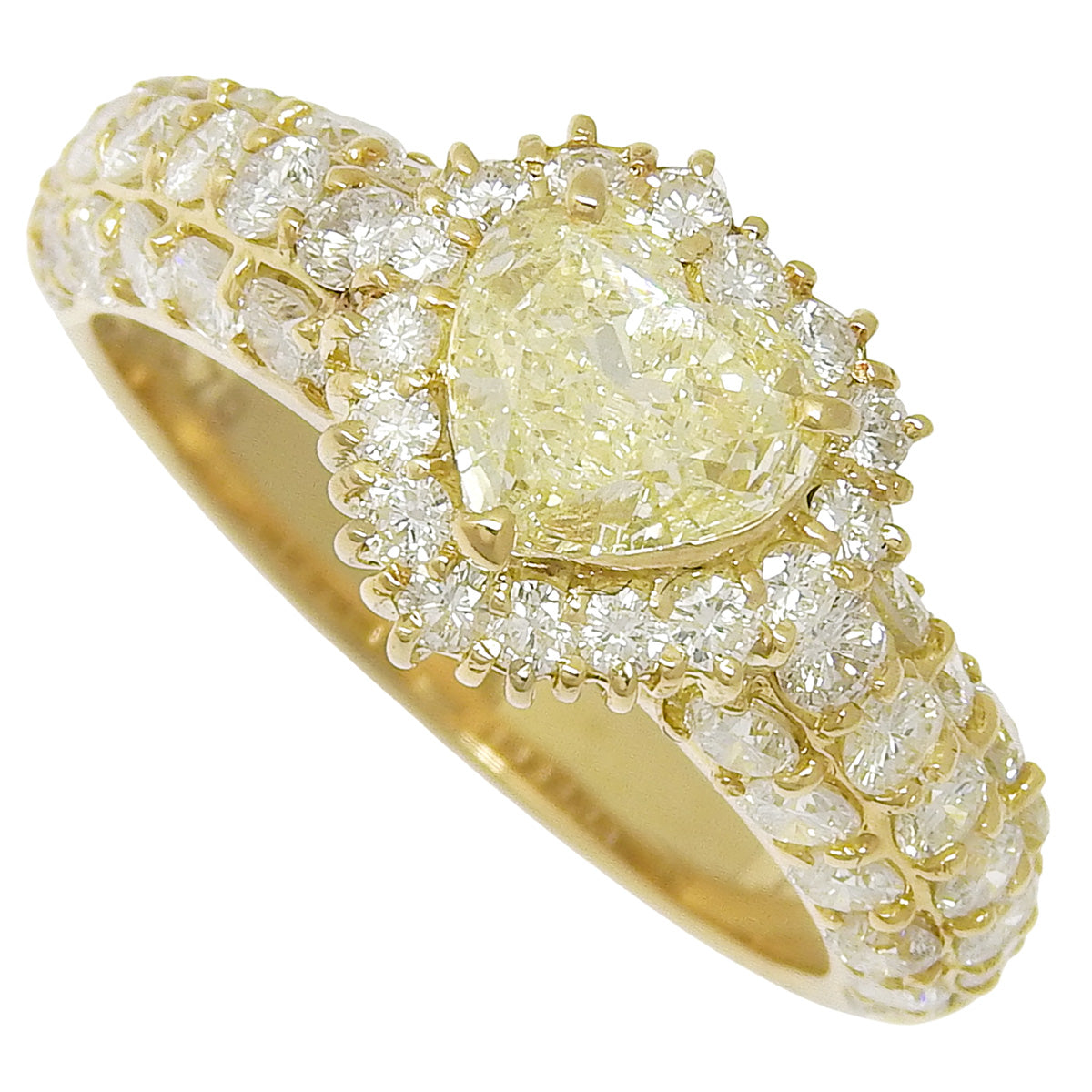 Heart-shaped diamond ring, 0.579 carats, 1.34 grams, 18K yellow gold.