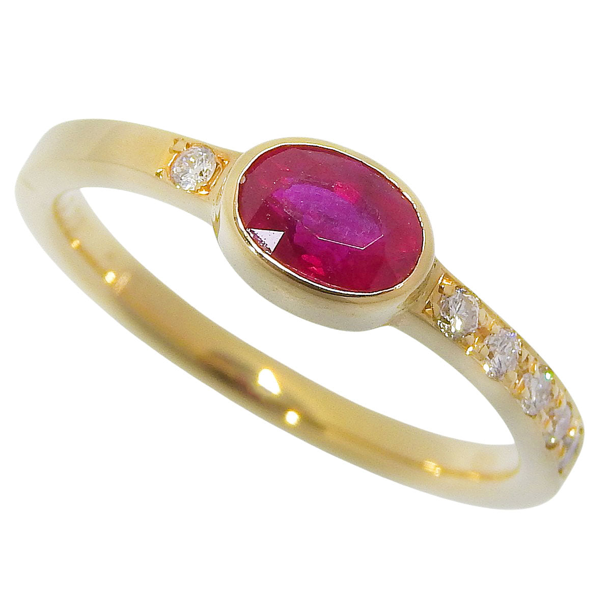 Ruby and Diamond Ring: 0.78 carats of rubies, 0.13 carats of diamonds, 18k yellow gold.