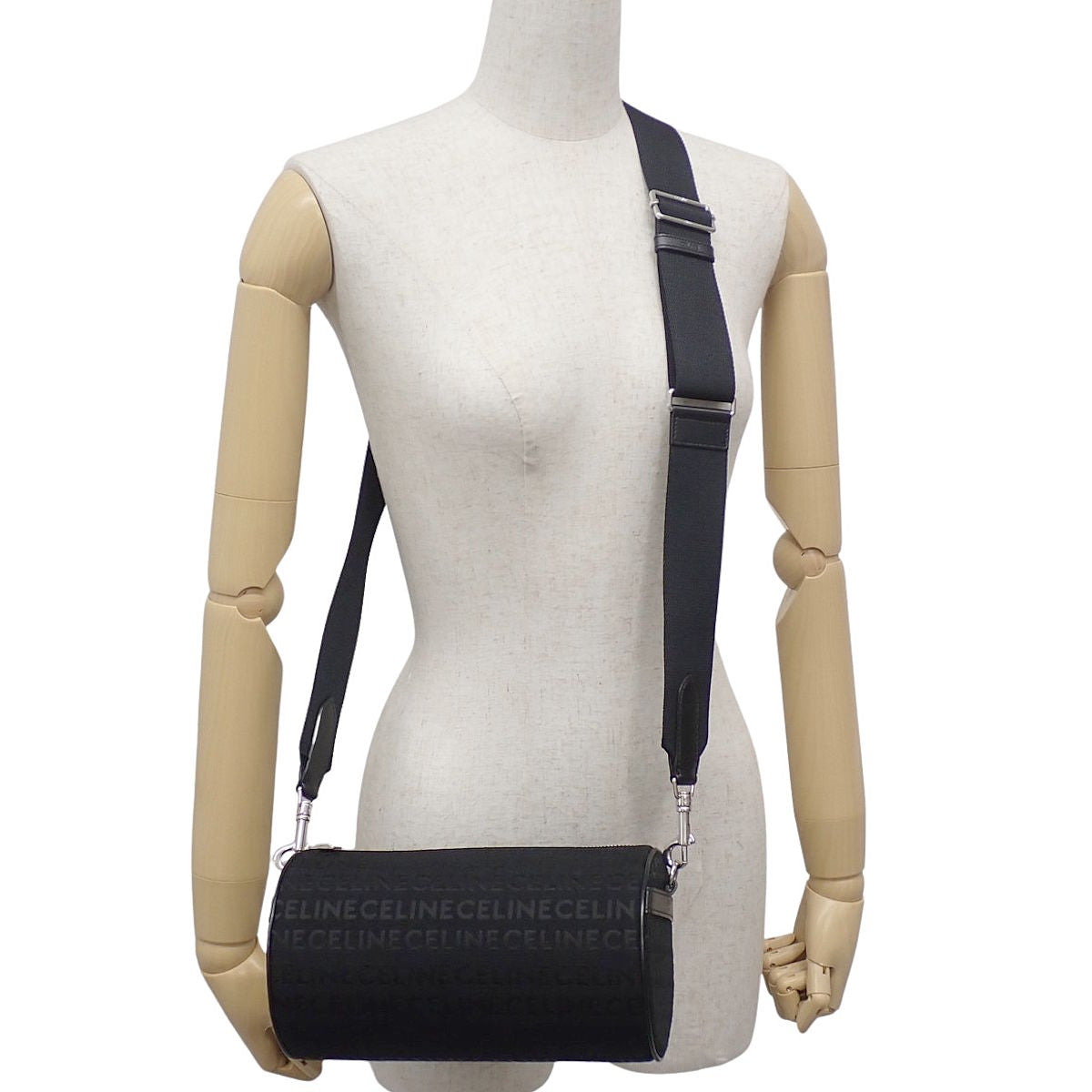 Cylinder shoulder bag in canvas and leather in black