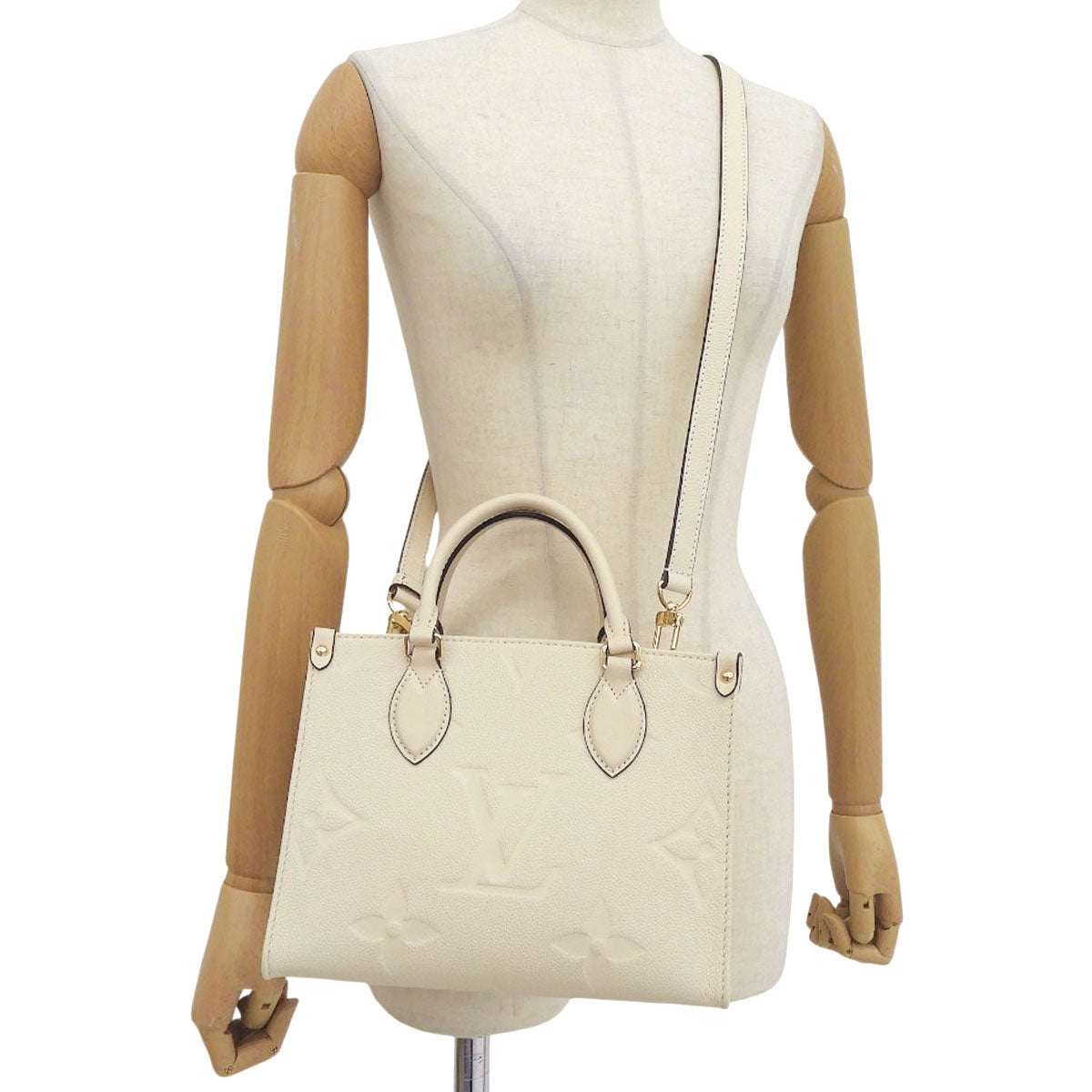 Monogram Empreinte Onthego PM Crème M46569