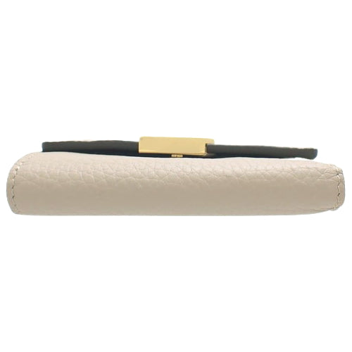 Portefeuille Capucines XS Tri-fold Wallet in Taurillon Leather, Galle M68747 (current product as of May 2024)
