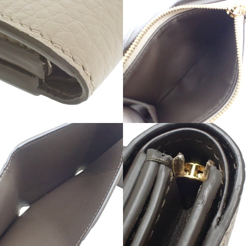 Portefeuille Capucines XS Tri-fold Wallet in Taurillon Leather, Galle M68747 (current product as of May 2024)