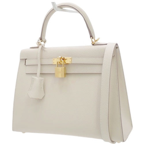 Kelly 25 (Exterior Stitched) Voe Epsom Leather, Cre color, Gold Hardware, U stamp.