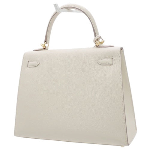 Kelly 25 (Exterior Stitched) Voe Epsom Leather, Cre color, Gold Hardware, U stamp.