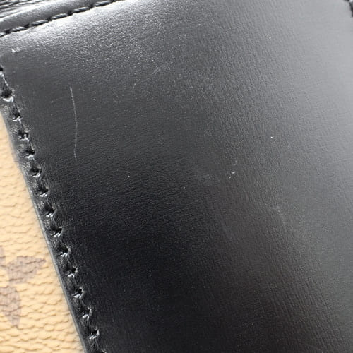 Monogram Reverse Cannes 帆布和小牛皮化妆包，M43986