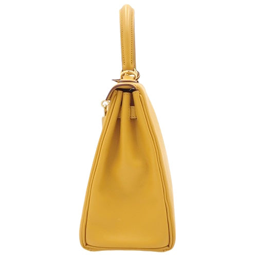 Kelly 25 (inner-stitched) Swift calfskin, Jeune Ambre color, gold hardware, Z stamp.