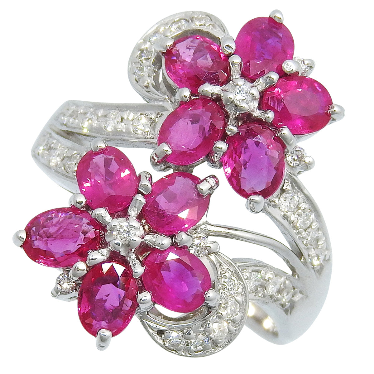 Flower motif ruby and diamond ring, 2.84 carats ruby / 0.28 carats diamond, 18K white gold.